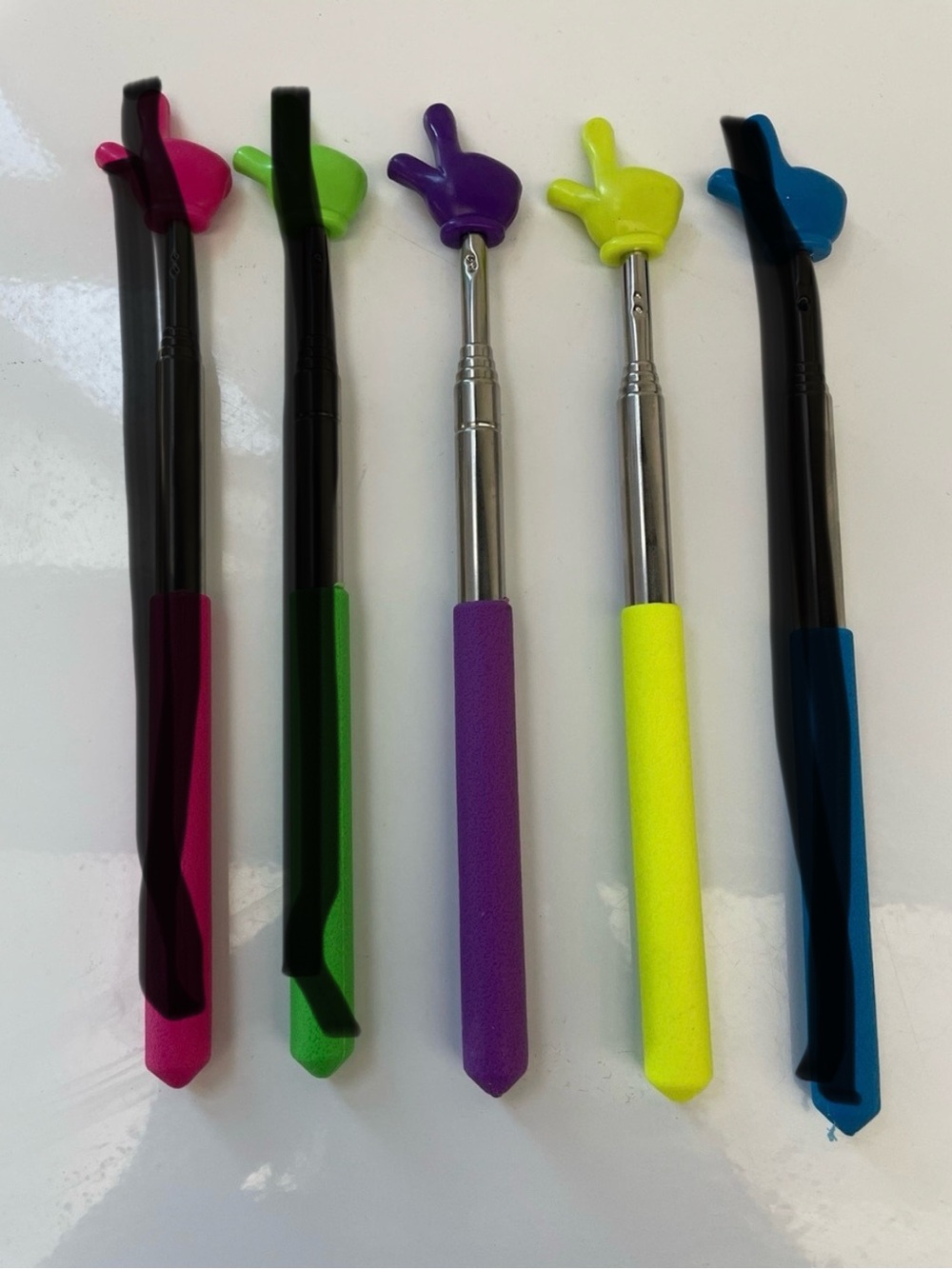 Choose one Yellow or Purple mini pointer finger sticks